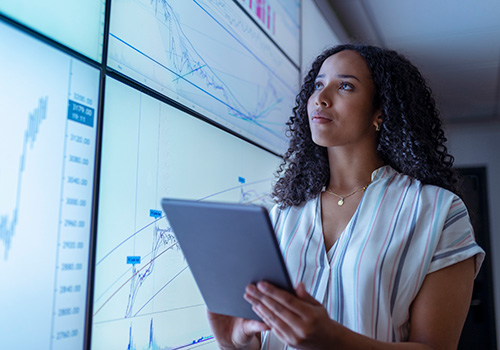Woman overseeing data on dashboard